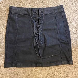 Black lace up mini skirt.